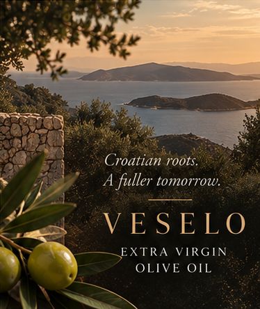 Sunset over the Adriatic coast, with islands, a dry-stone wall and olive branches in the foreground.
