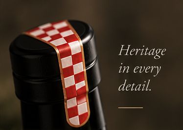 The red and white checkerboard seal on a Veselo bottle.
